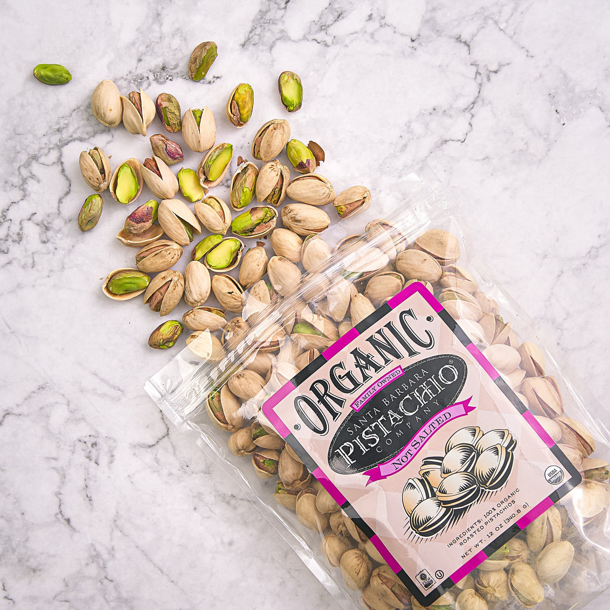 SANTA BARBARA organic unsalted pistachios, clear bag with label and scattered nuts