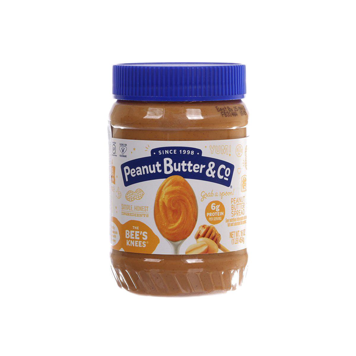 Peanut butter spread jar with blue lid and honey-peanut front label