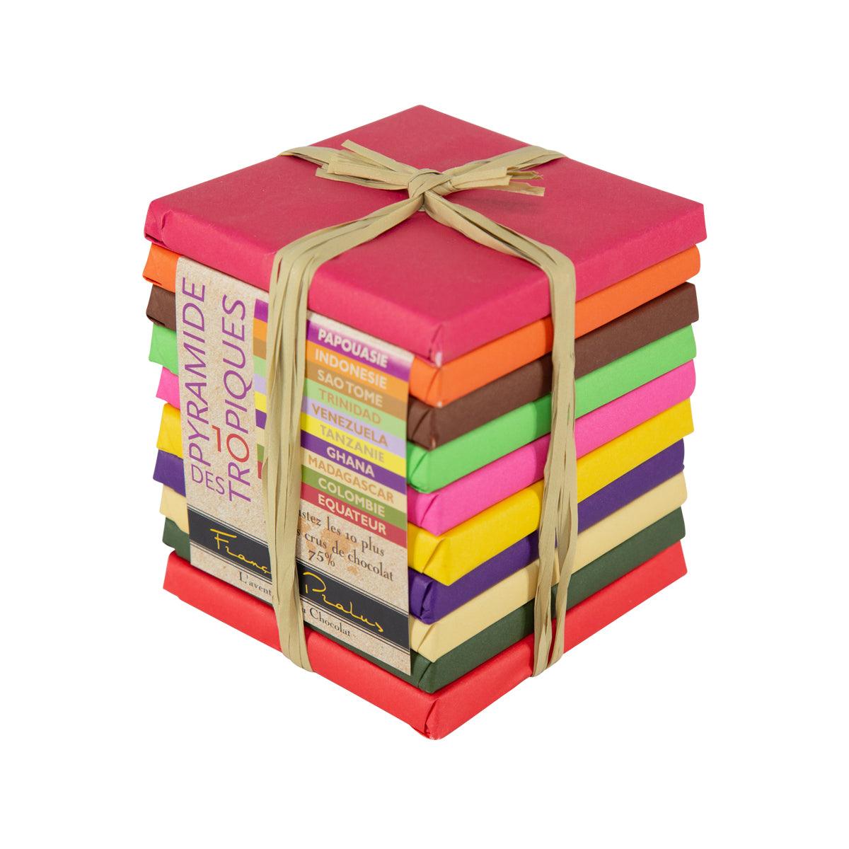 Stacked pyramid tropical chocolate boxes tied with beige ribbon