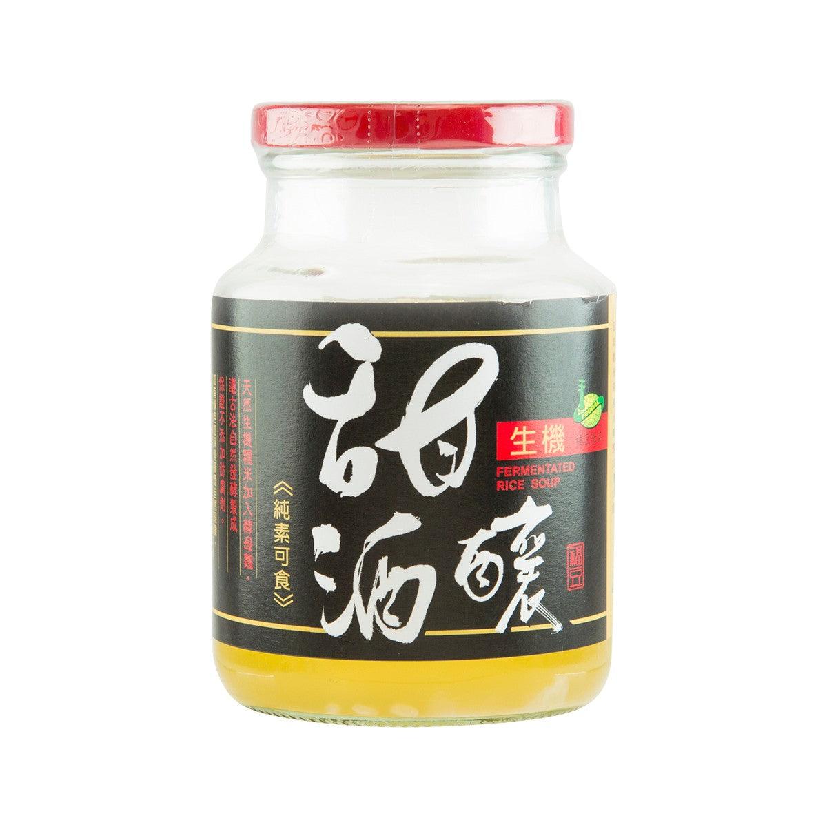 Jar of fermented rice soup with red lid and black label