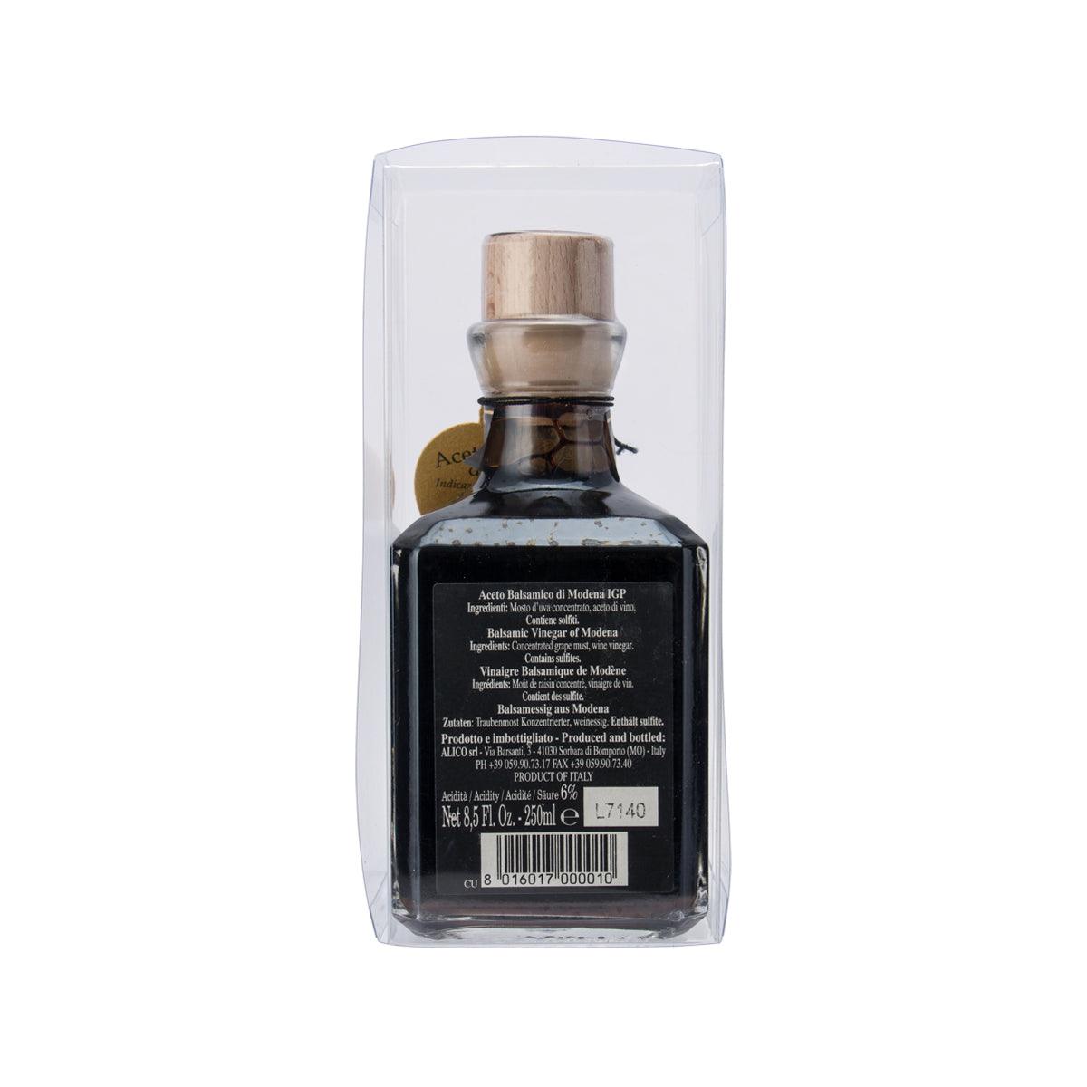 Balsamic vinegar bottle with cork top, detailed front label in clear box