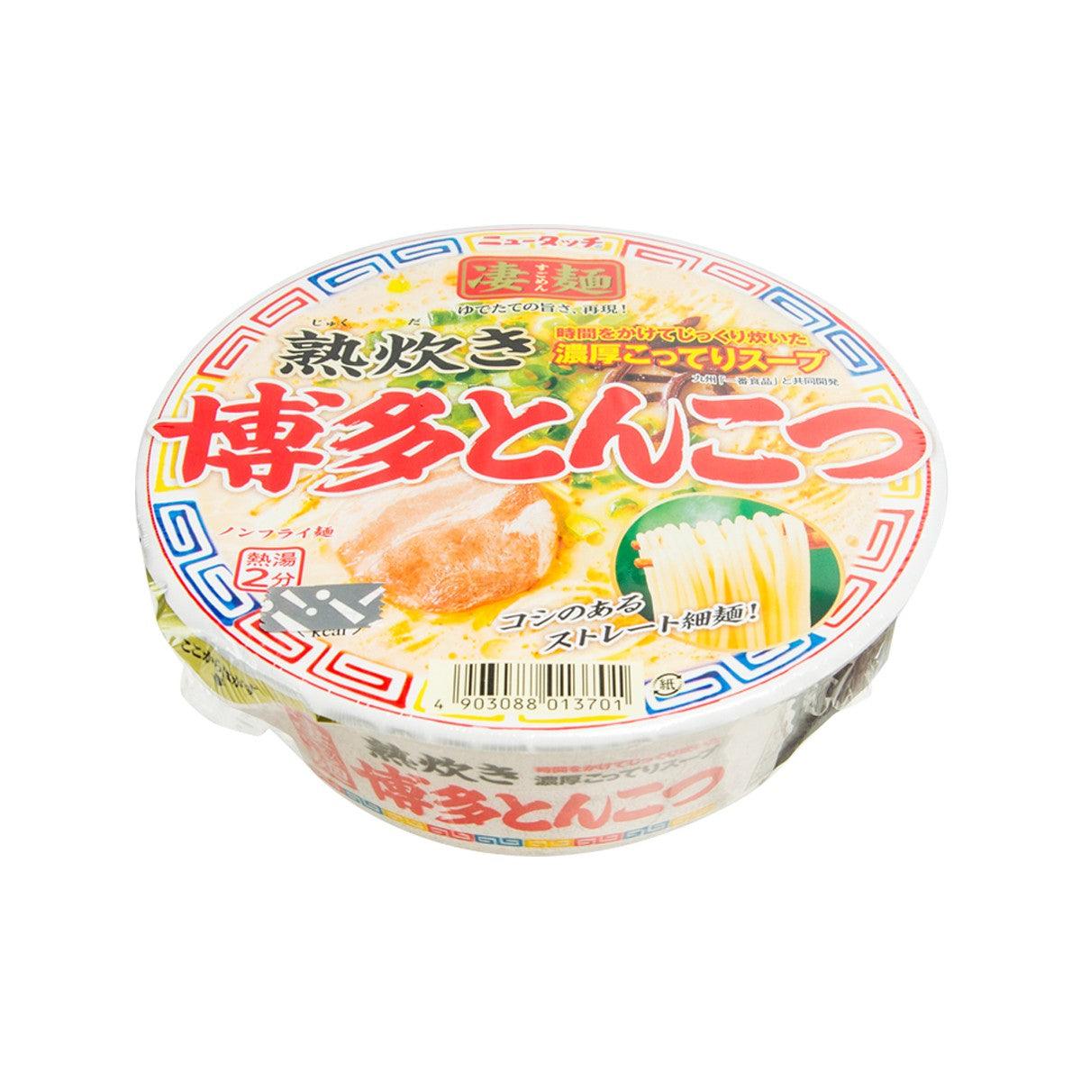 Instant ramen noodle cup angled view with pork bone soup label and noodle drawing