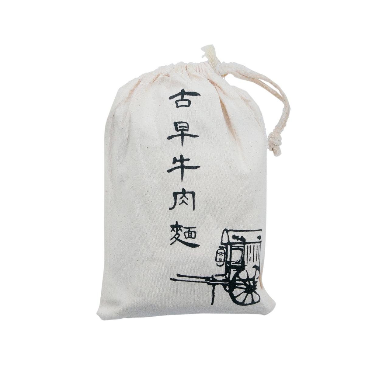 White cloth drawstring pouch for original beef noodle, printed with Chinese text and cart