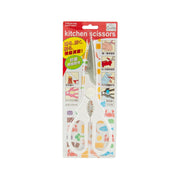Kitchen scissors with white blades and orange handles on retail card