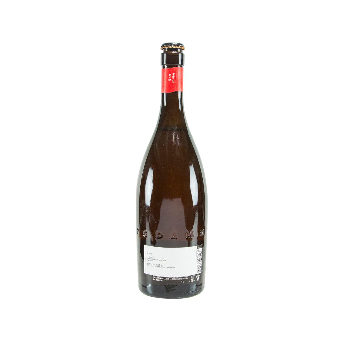 Dark beer bottle with gold cap and back label with barcode and small text