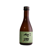 Junmai sake bottle, brown glass with black cap and front paper label