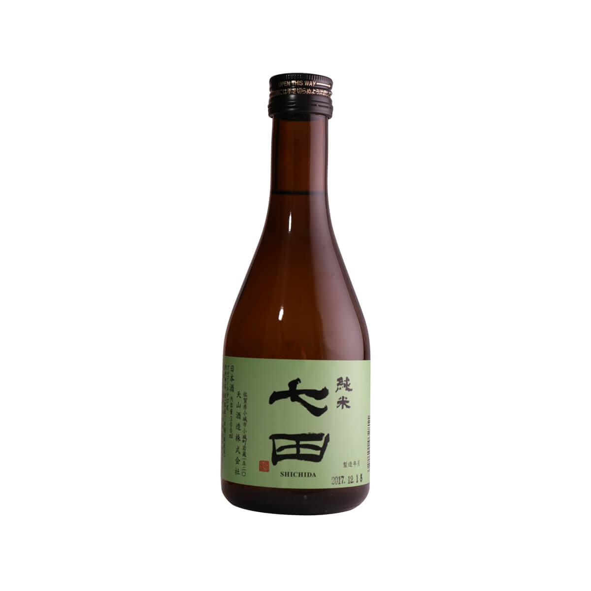 Junmai sake bottle, brown glass with black cap and front paper label