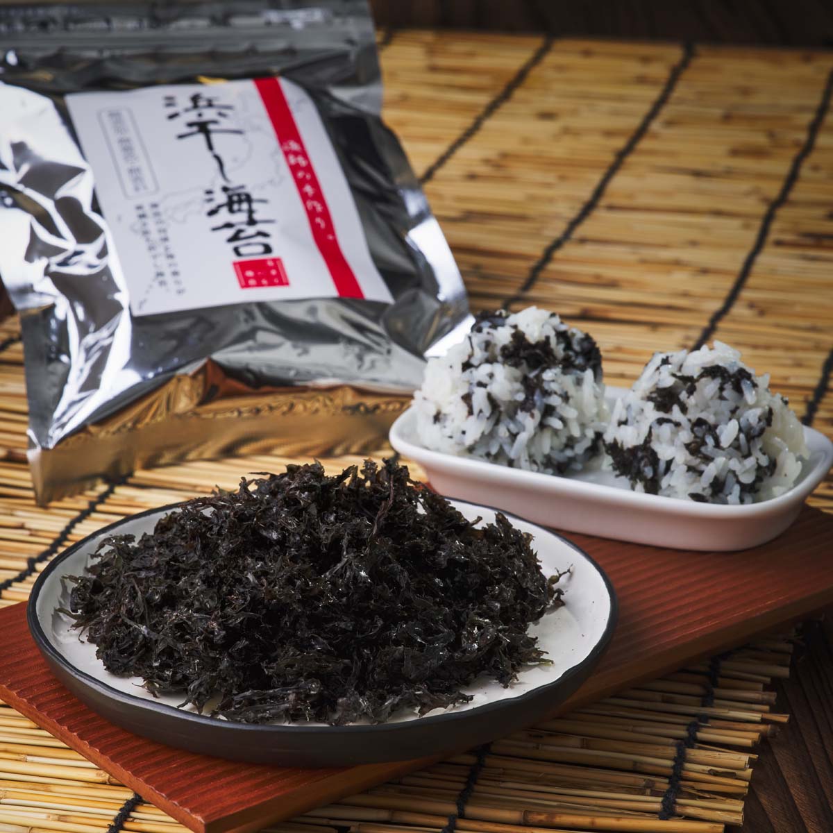 Sun-dried nori seaweed flakes in bowls with silver pouch behind