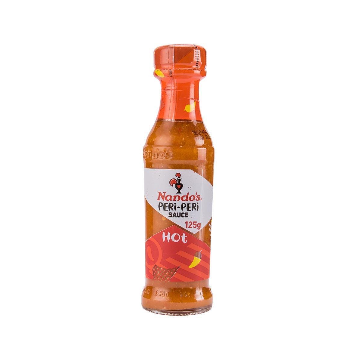Nando's Hot peri-peri sauce bottle with front label, orange-red, 125g