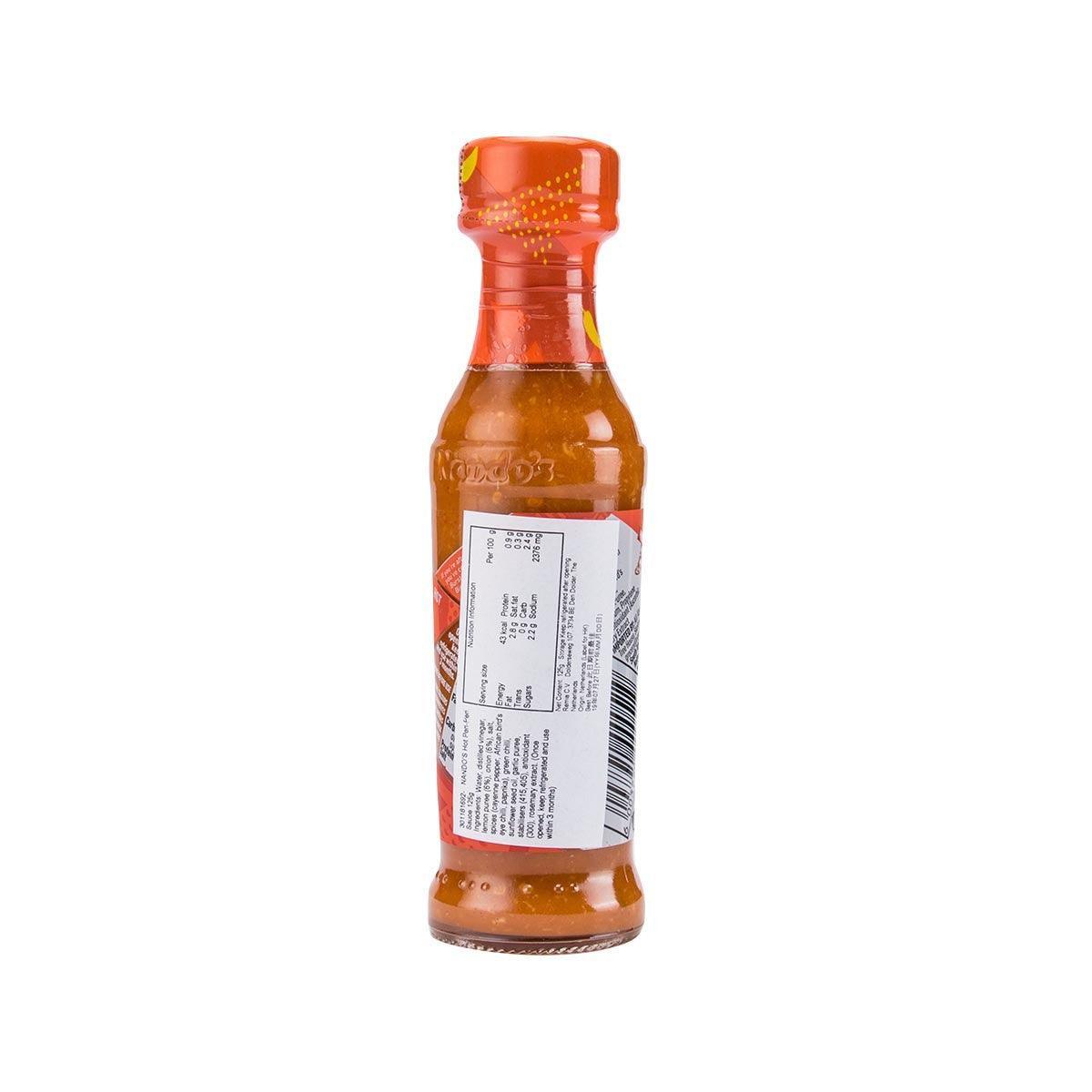 Nando's Hot peri-peri sauce bottle with back label and barcode, orange-red, 125g