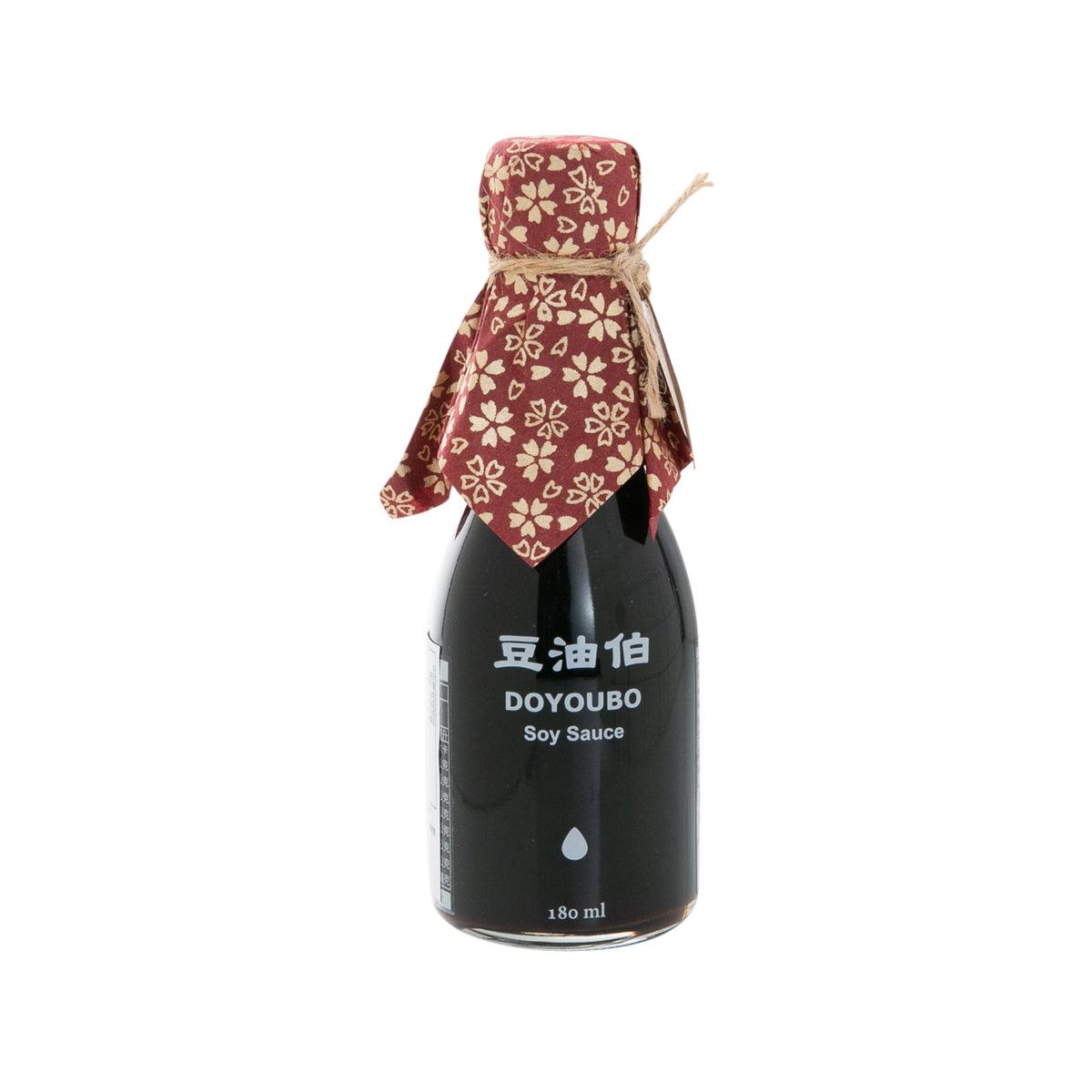 Soy sauce bottle with maroon floral fabric cap and neck wrap, 180 mL.