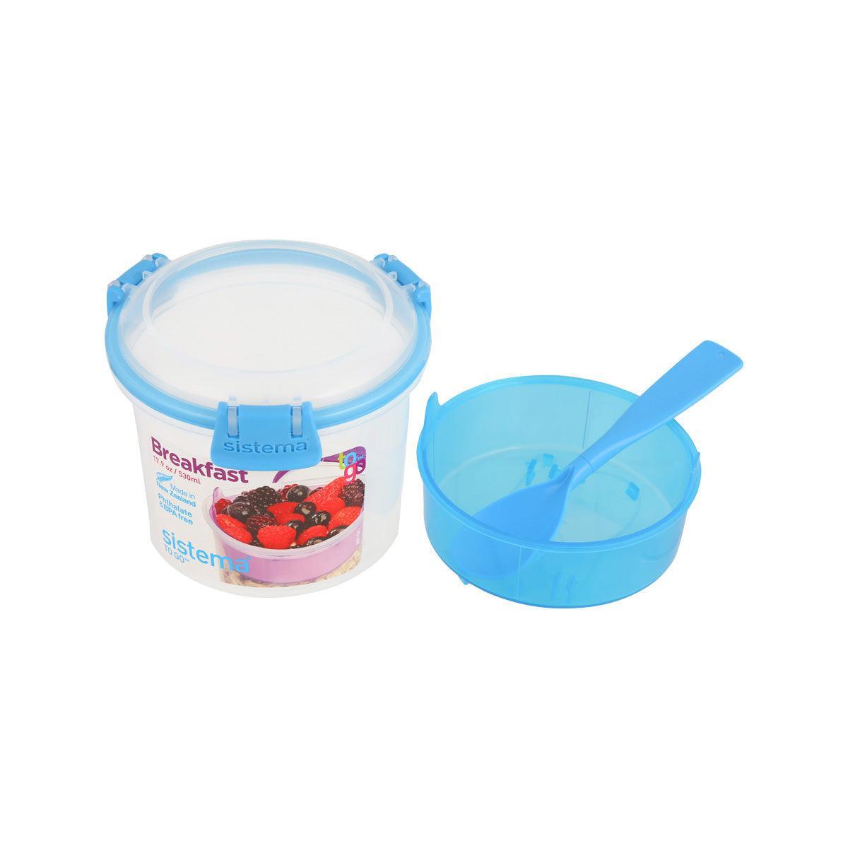 Clear container with blue lid and pour spout, plus blue inner scoop for snacks