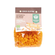 Organic gluten-free corn alphabet pasta in PROBIOS pouch, showing orange letter-shaped pieces.