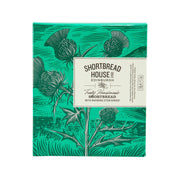 Shortbread tin box with green botanical design and warming stem ginger label
