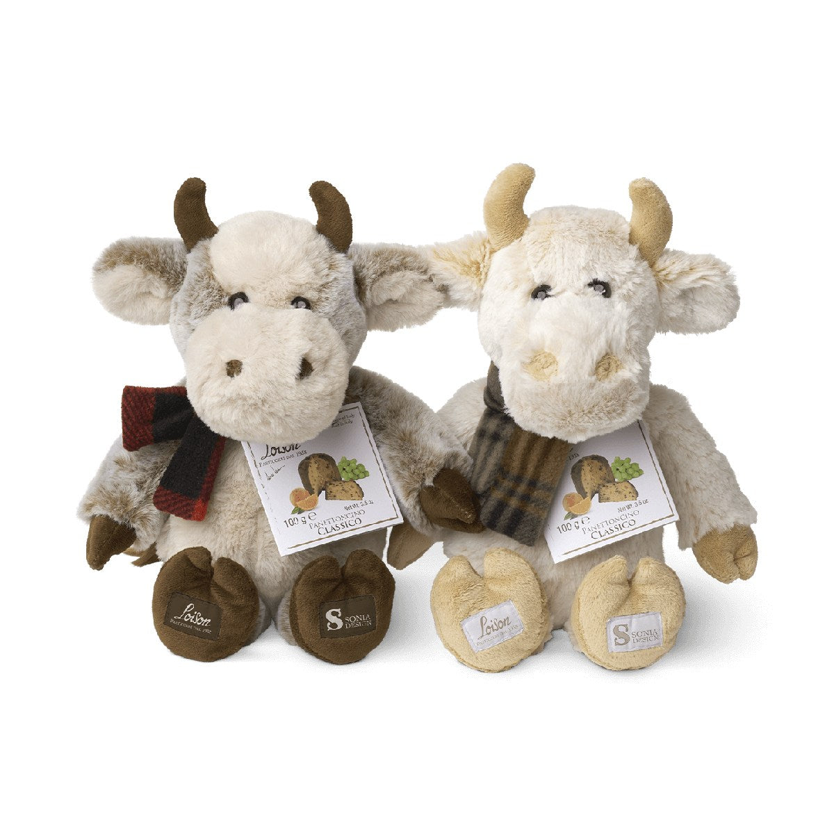 Pair of plush cow figures with fabric horns and product tags, gray and cream