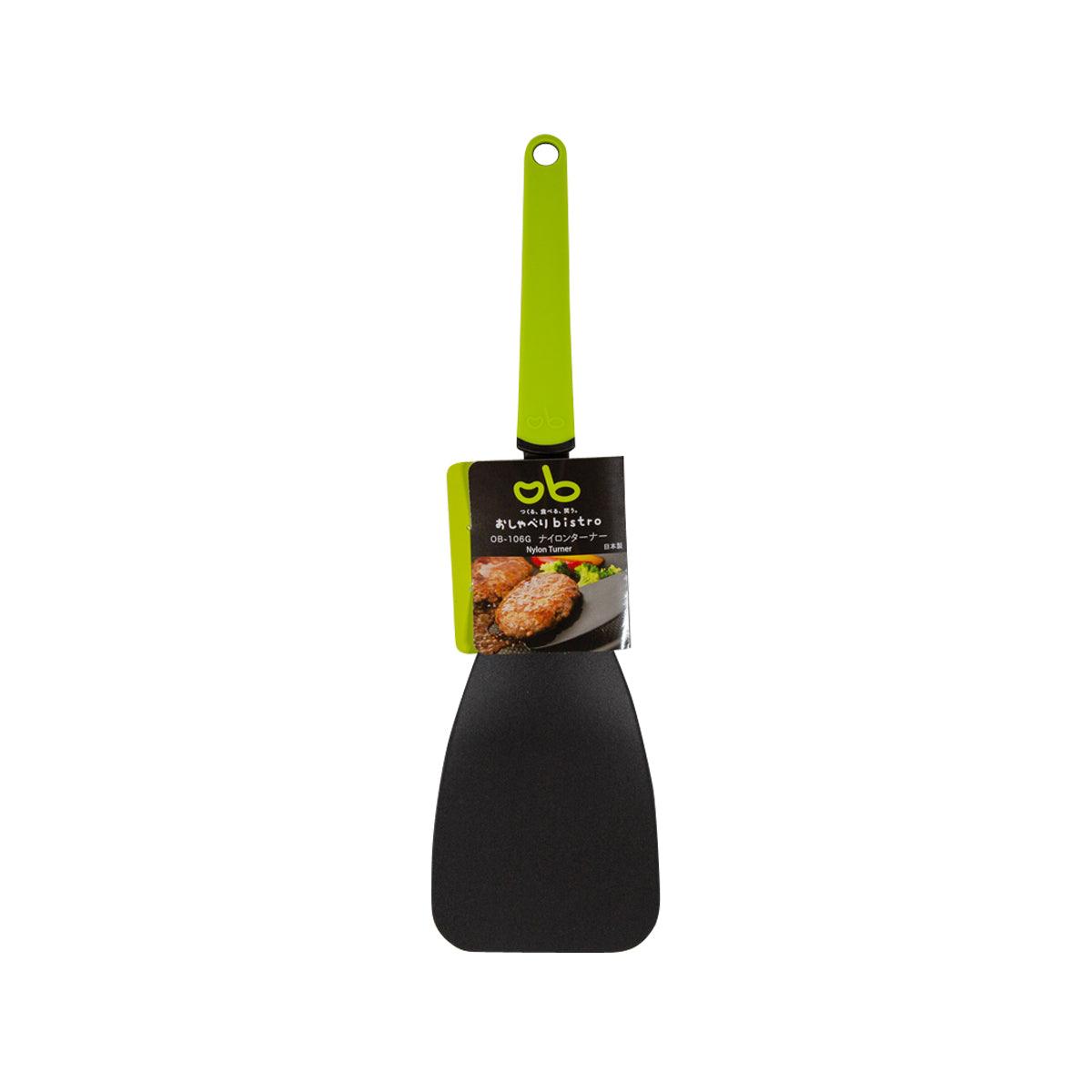 Nylon kitchen turner with lime green handle and black square head