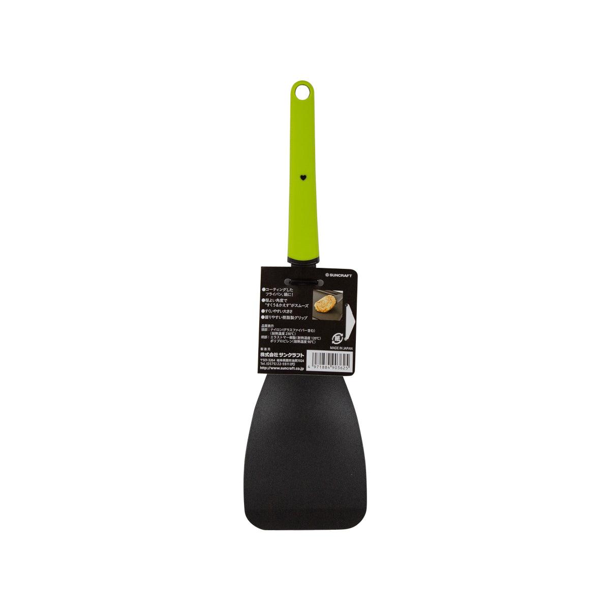 Nylon kitchen turner with lime green handle and black flat head, rear label