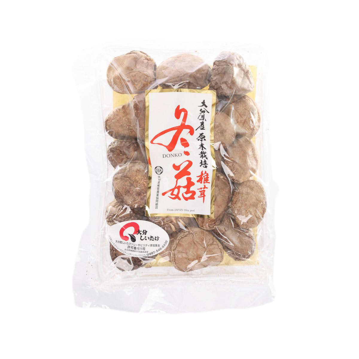 Dried shiitake mushroom pieces in clear plastic bag, brown