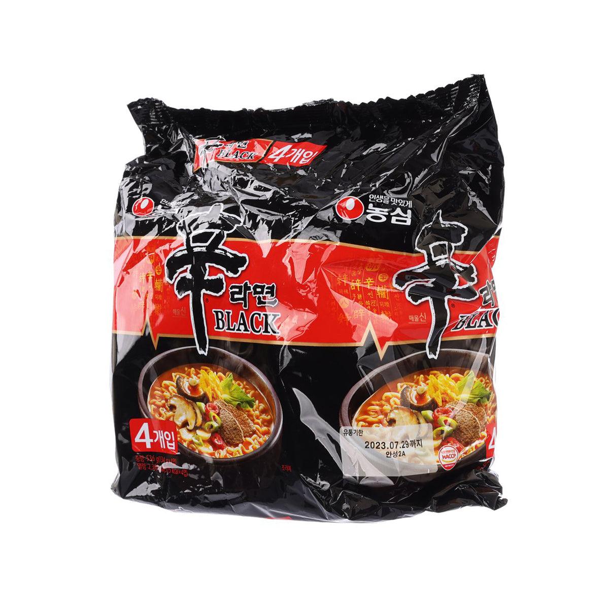 Spicy ramen noodle pack, black and red, 4 servings shown with two bowls