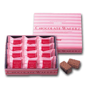 Strawberry cream chocolate wafers in pink striped box with wrapped pieces