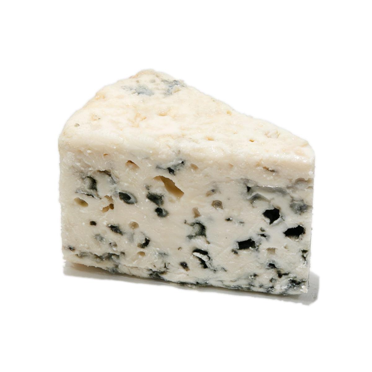 Roquefort cheese wedge with creamy white interior and blue mold veins