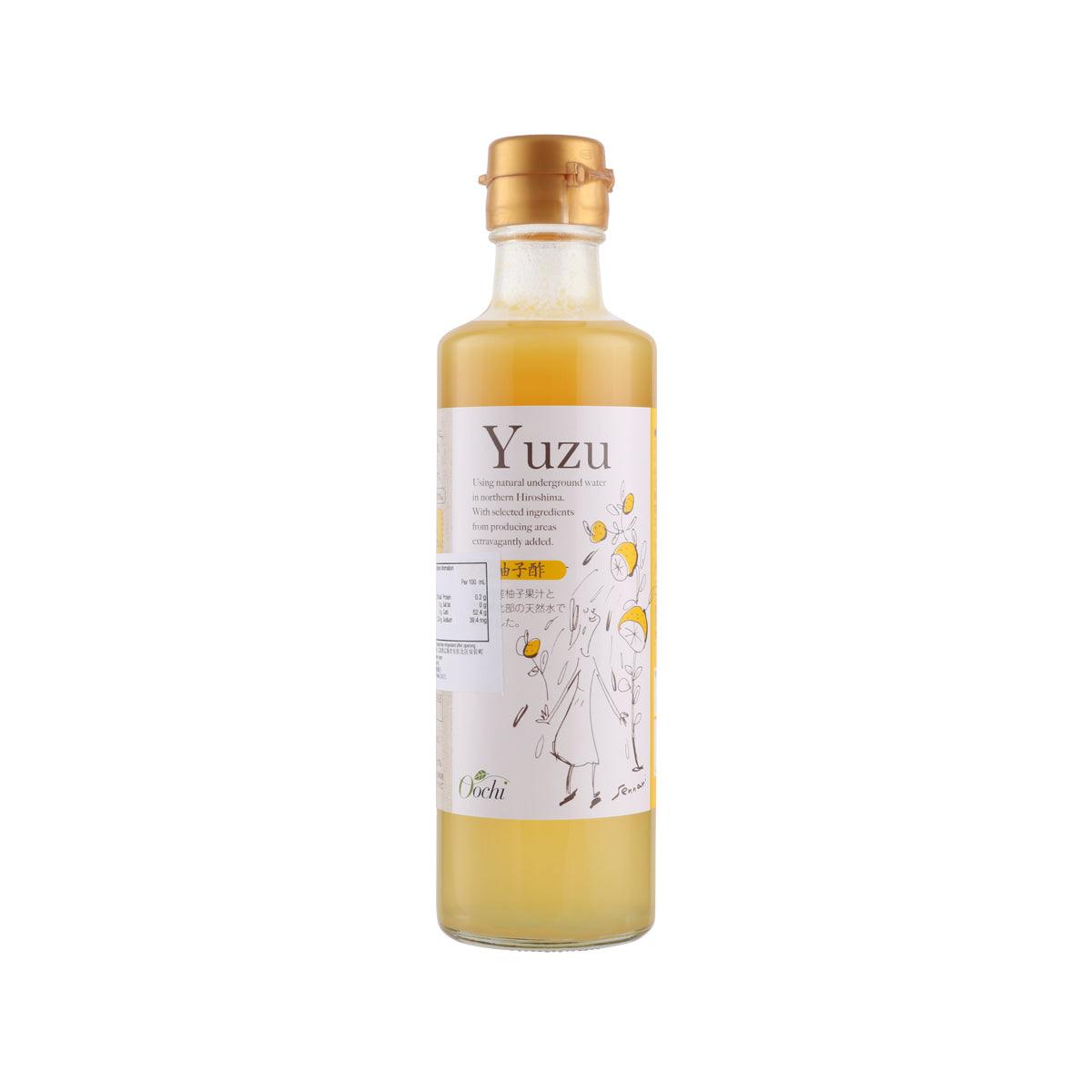 Yuzu-flavor vinegar drink bottle with gold cap and amber liquid, front label