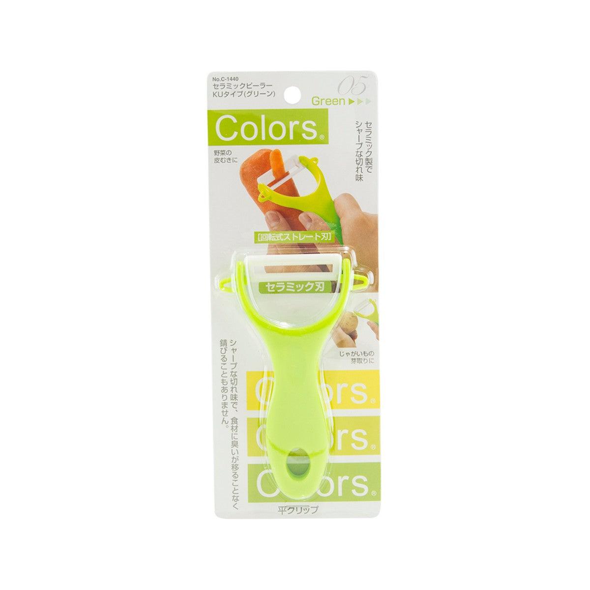 Green ceramic peeler in retail packaging, yellow-green handle with ceramic blade