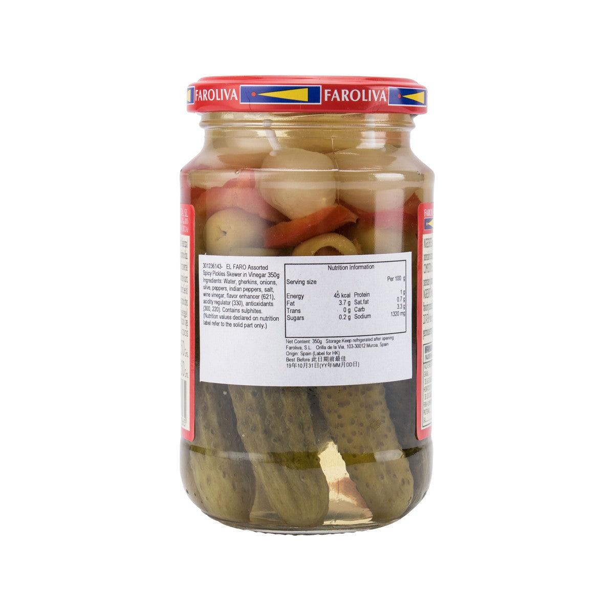 Glass jar of pickled cucumbers and hot peppers with brine, back label visible