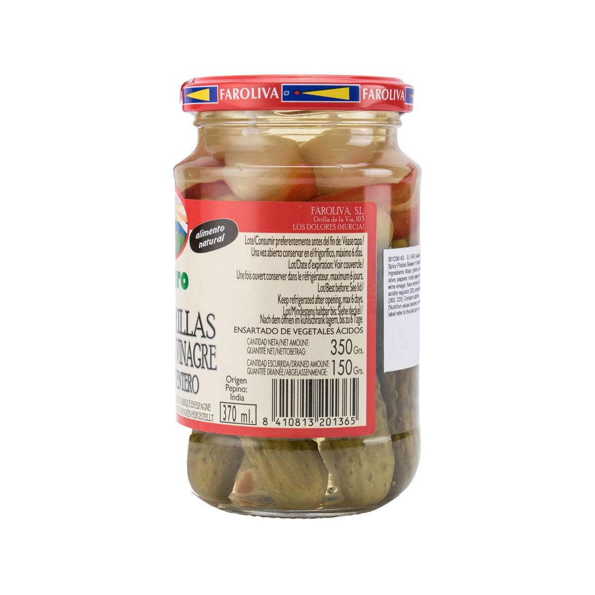 Glass jar of pickled whole gherkins and hot peppers, nutrition label on reverse