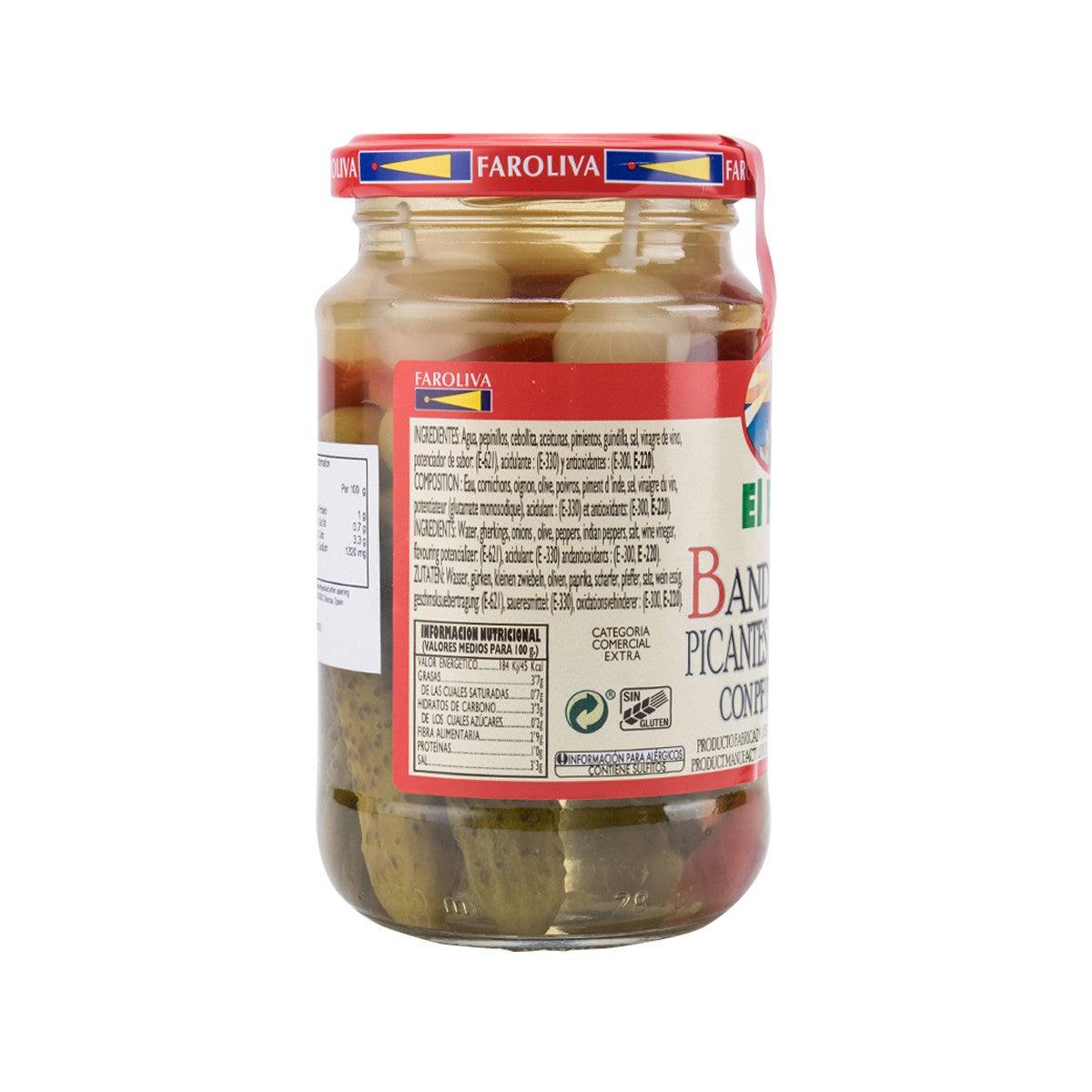 Glass jar of pickled hot banderillas and whole gherkins, side label visible