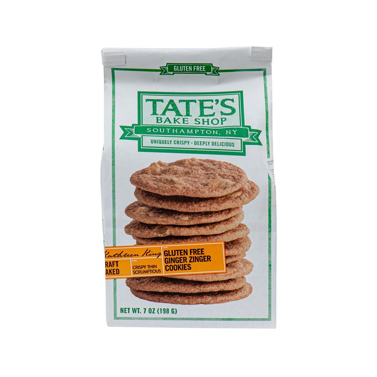 TATE'S gluten free ginger zinger cookie bag with stack of brown cookies