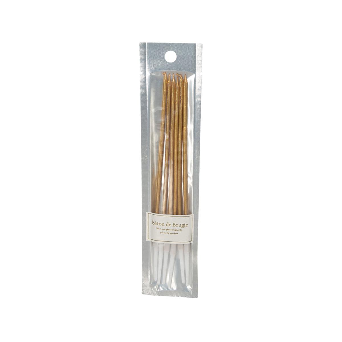CUXCO gold taper candles in clear sealed pouch