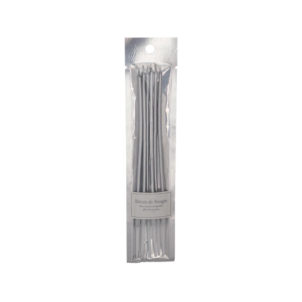 Silver taper candles in clear plastic sleeve, multiple stick candles