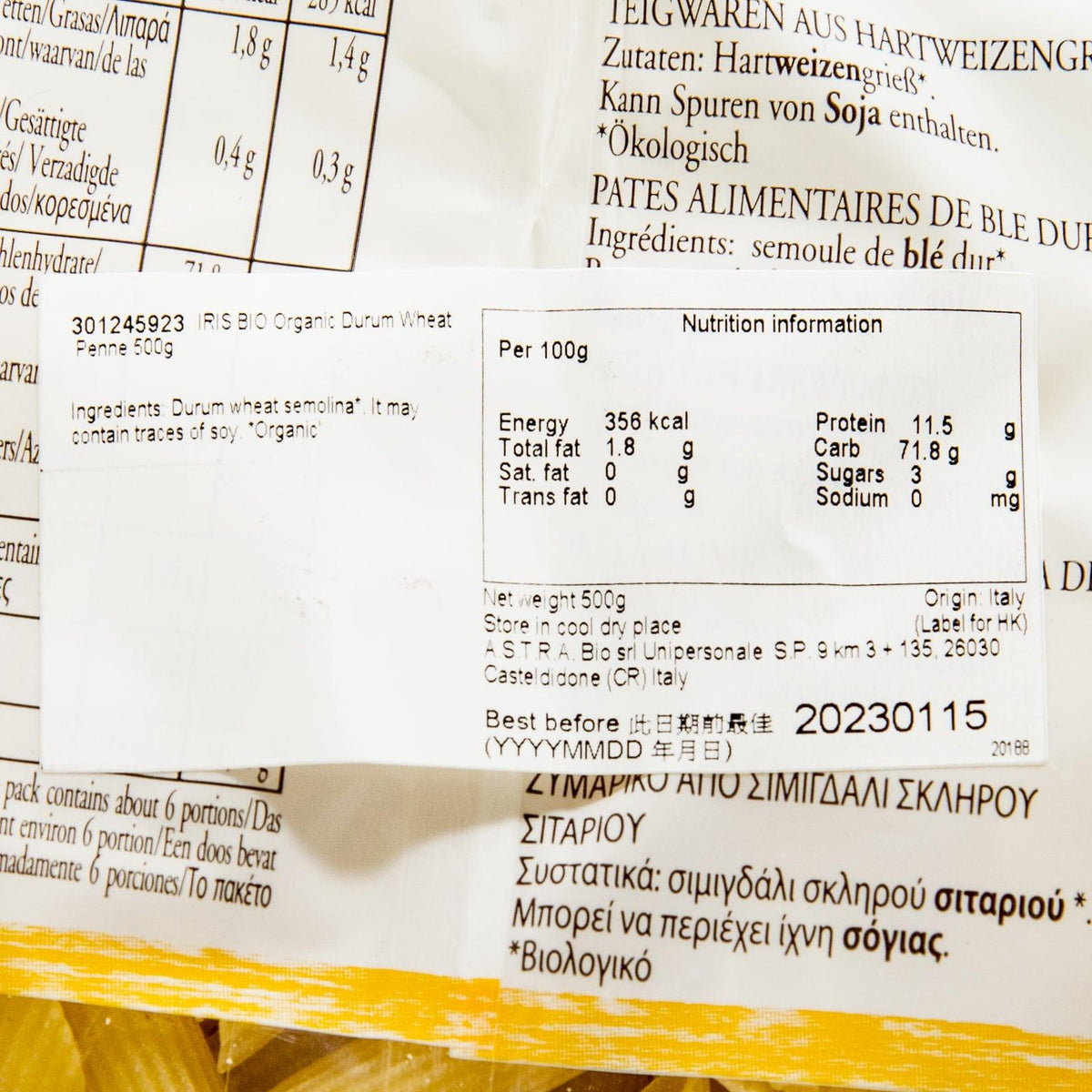 IRIS organic penne 500 g nutrition facts text on pasta bag label (close-up)