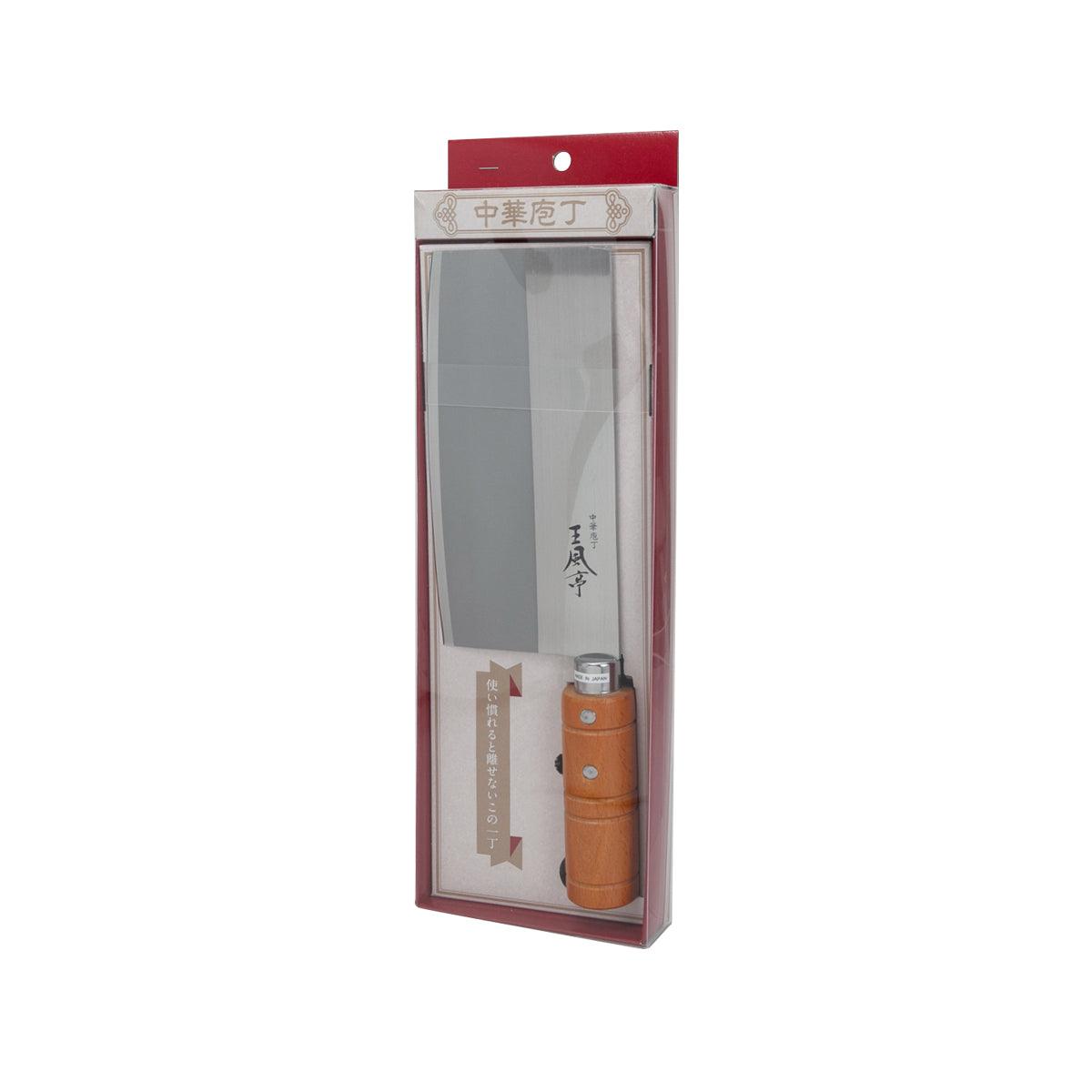 Stainless steel cleaver with orange wooden handle, packaged in clear sleeve