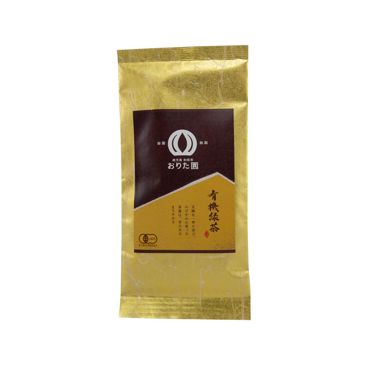 Green tea pouch with gold foil and dark front label, sealed.