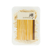 CHING Taiwan Yang Chun noodles, clear plastic tub with pale yellow noodle strands