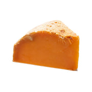Wedge of aged orange Mimolette raw cow’s milk cheese, about 24 months old