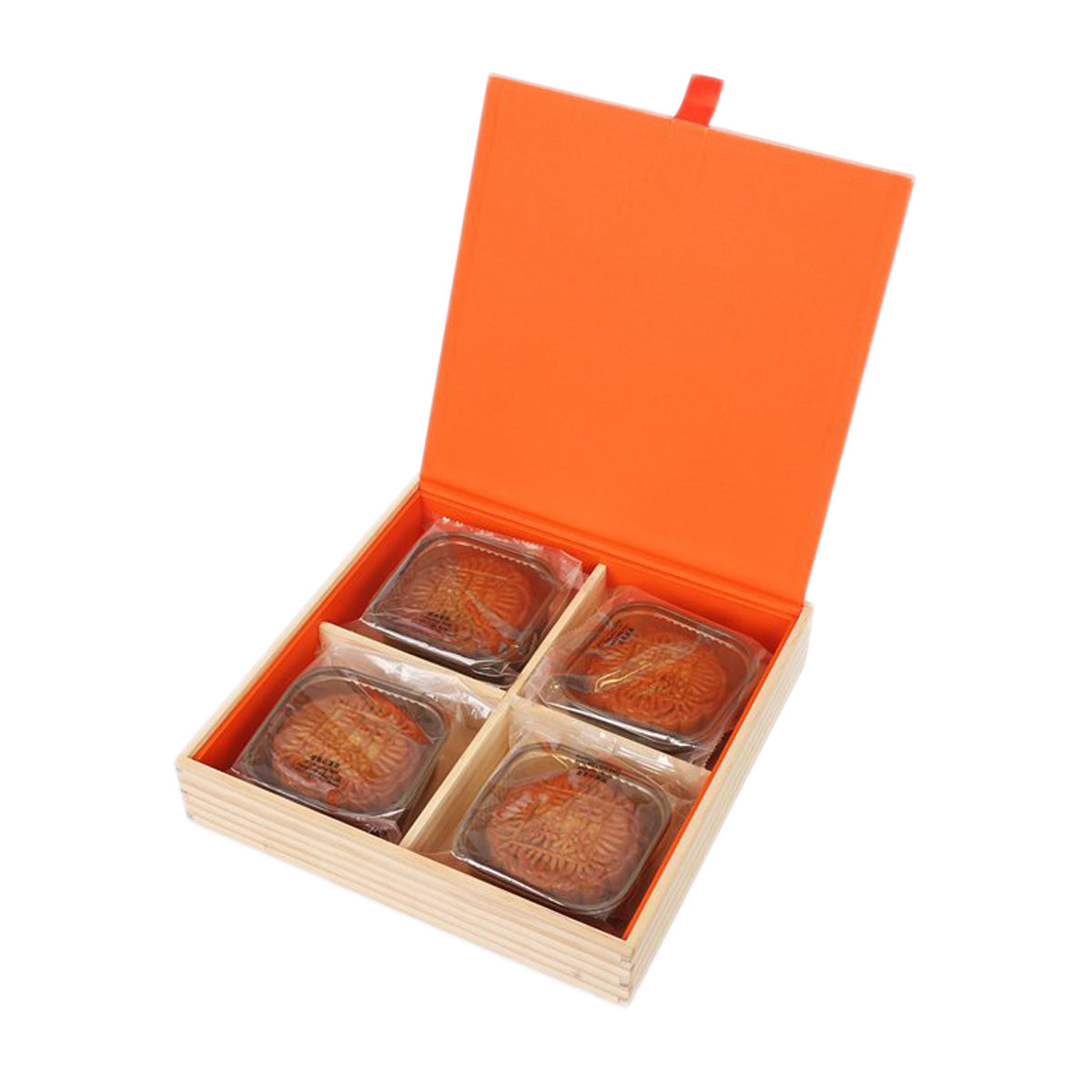 Opened mooncake gift box with orange lid; four mooncakes in clear compartments