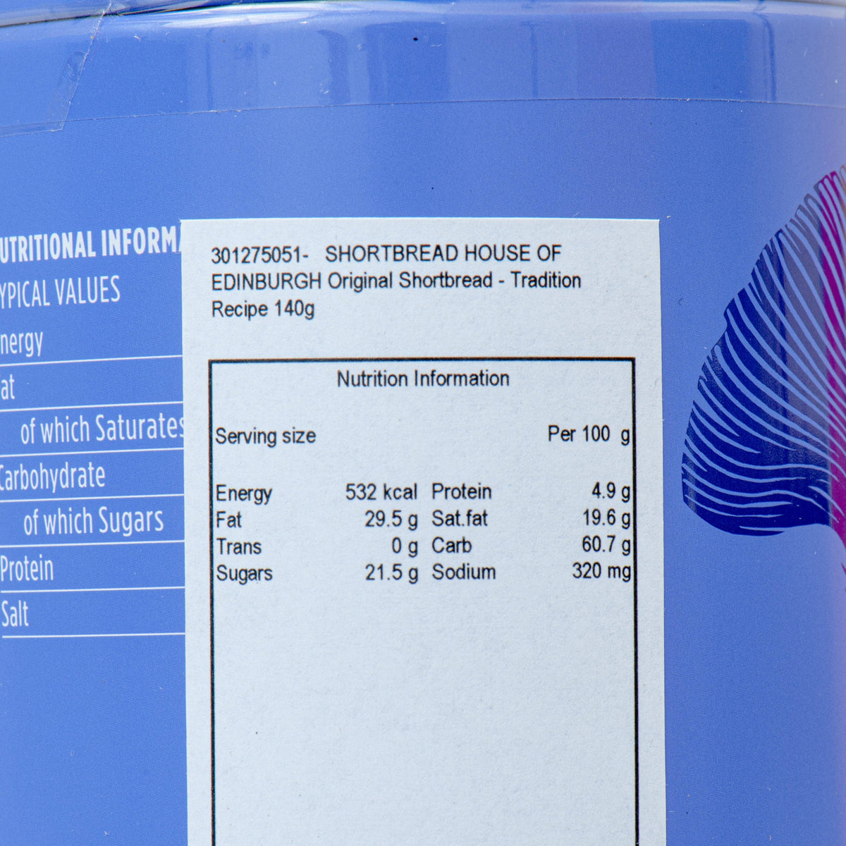 Close-up of blue shortbread tin nutrition label with serving and per-100g values