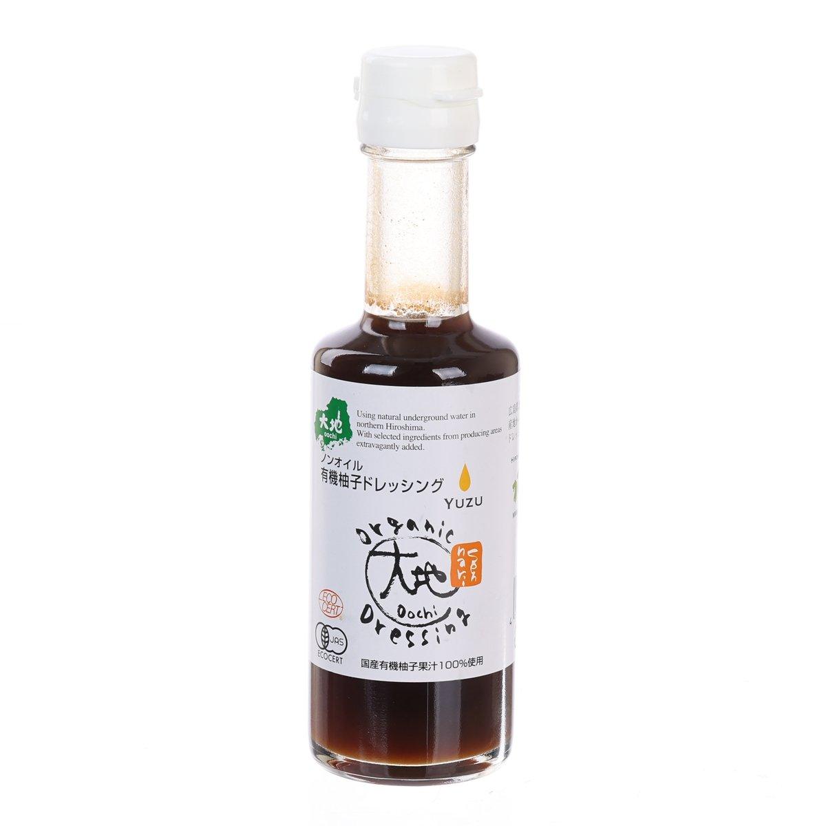 Organic yuzu citrus dressing bottle with dark amber liquid and clear cap, 175 mL