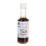 Organic yuzu citrus dressing bottle with dark amber liquid and clear cap, 175 mL