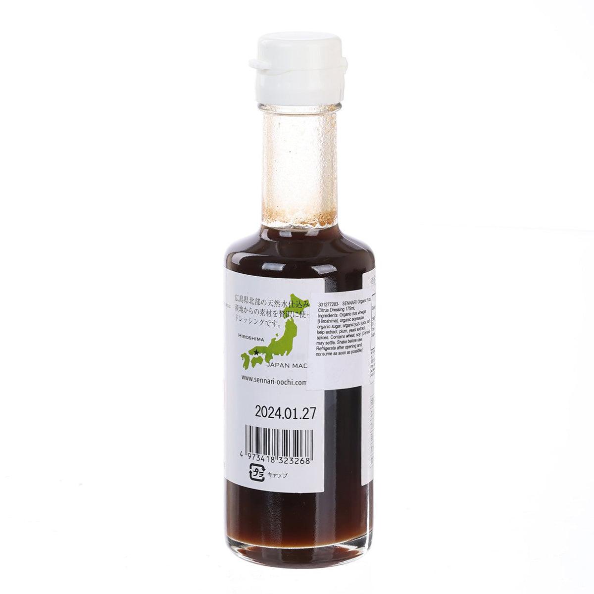 Organic yuzu citrus dressing bottle with label text and dark amber liquid, 175 mL