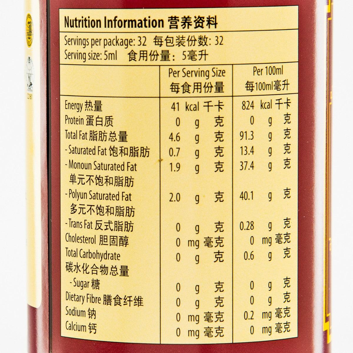 Sesame oil nutrition information panel on bottle, serving size 5 mL