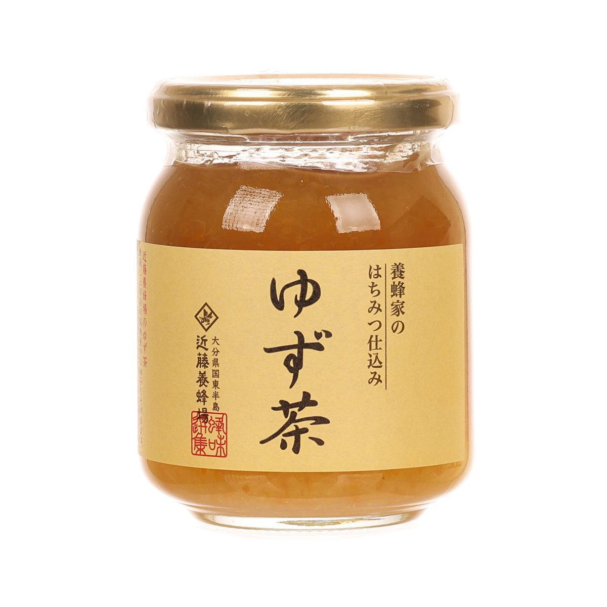 KONDO HONEY FACTORY yuzu citrus honey jar, amber honey with label on front.