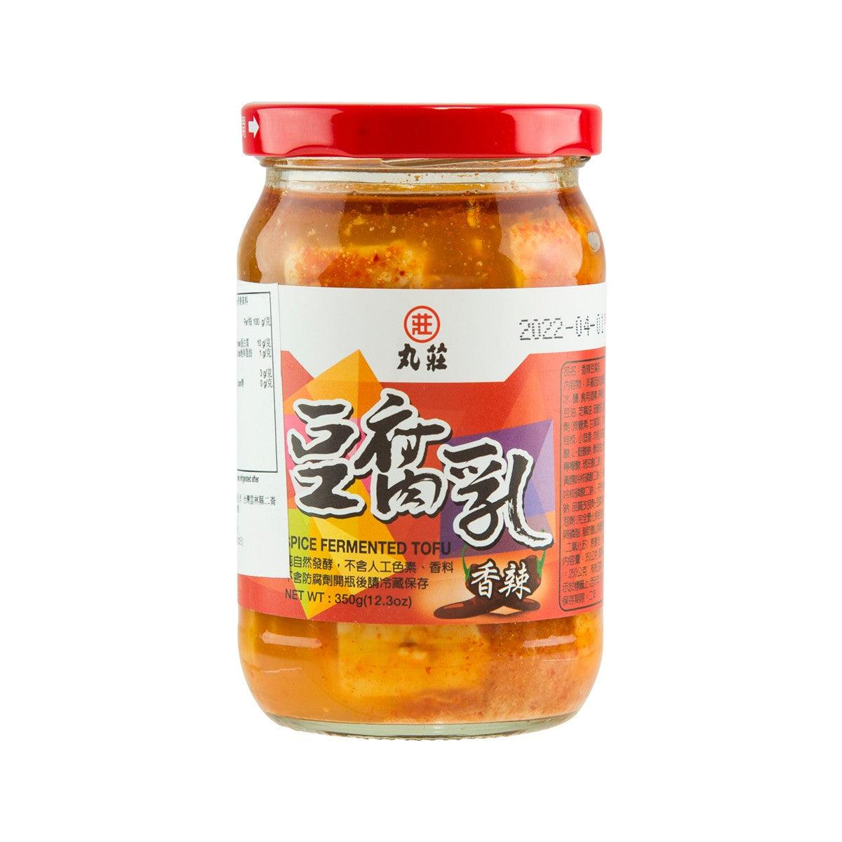 Spicy fermented tofu jar with red lid, orange chili bean curd in glass container