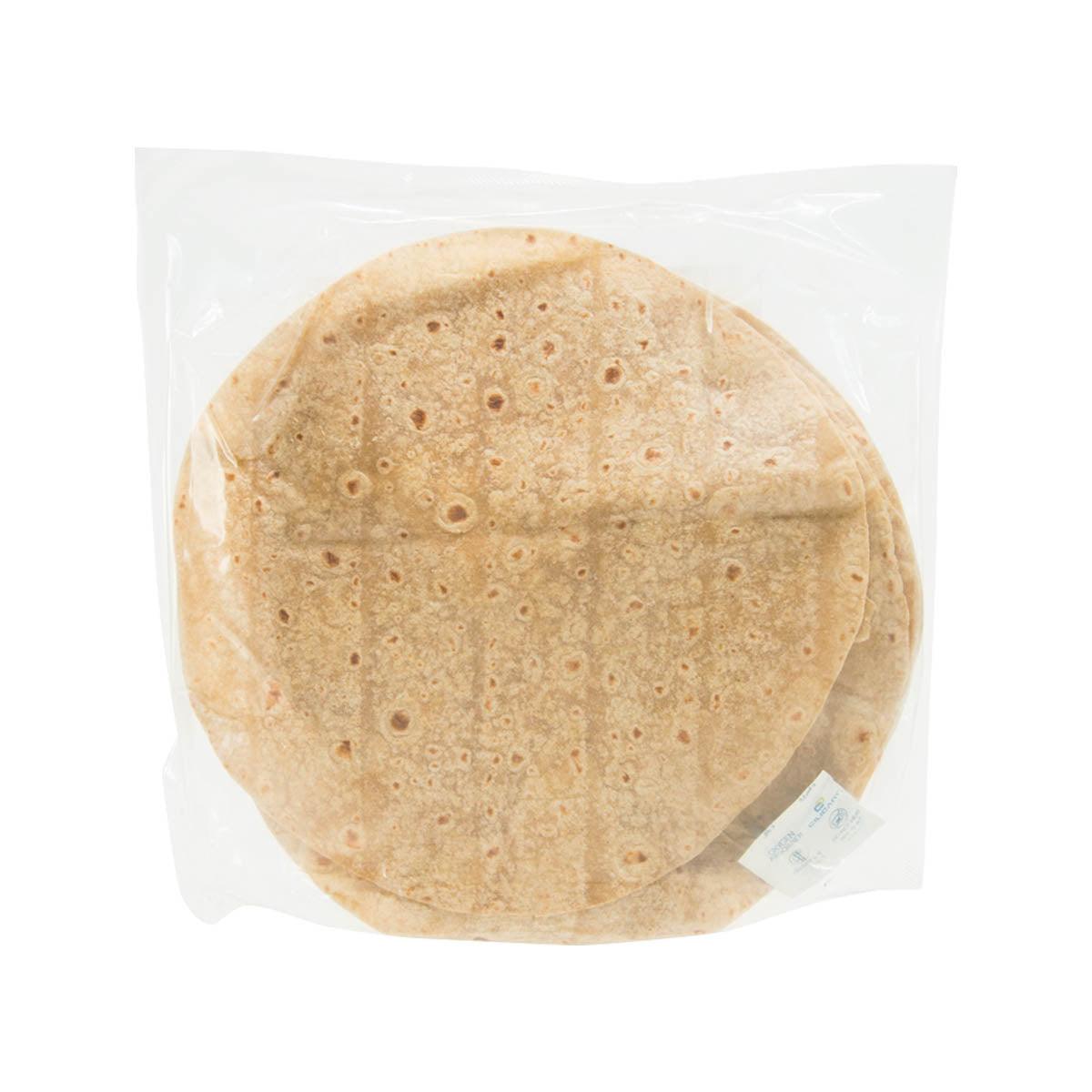 Round wholewheat chapati flatbread with toasted bubbles, in clear sealed bag