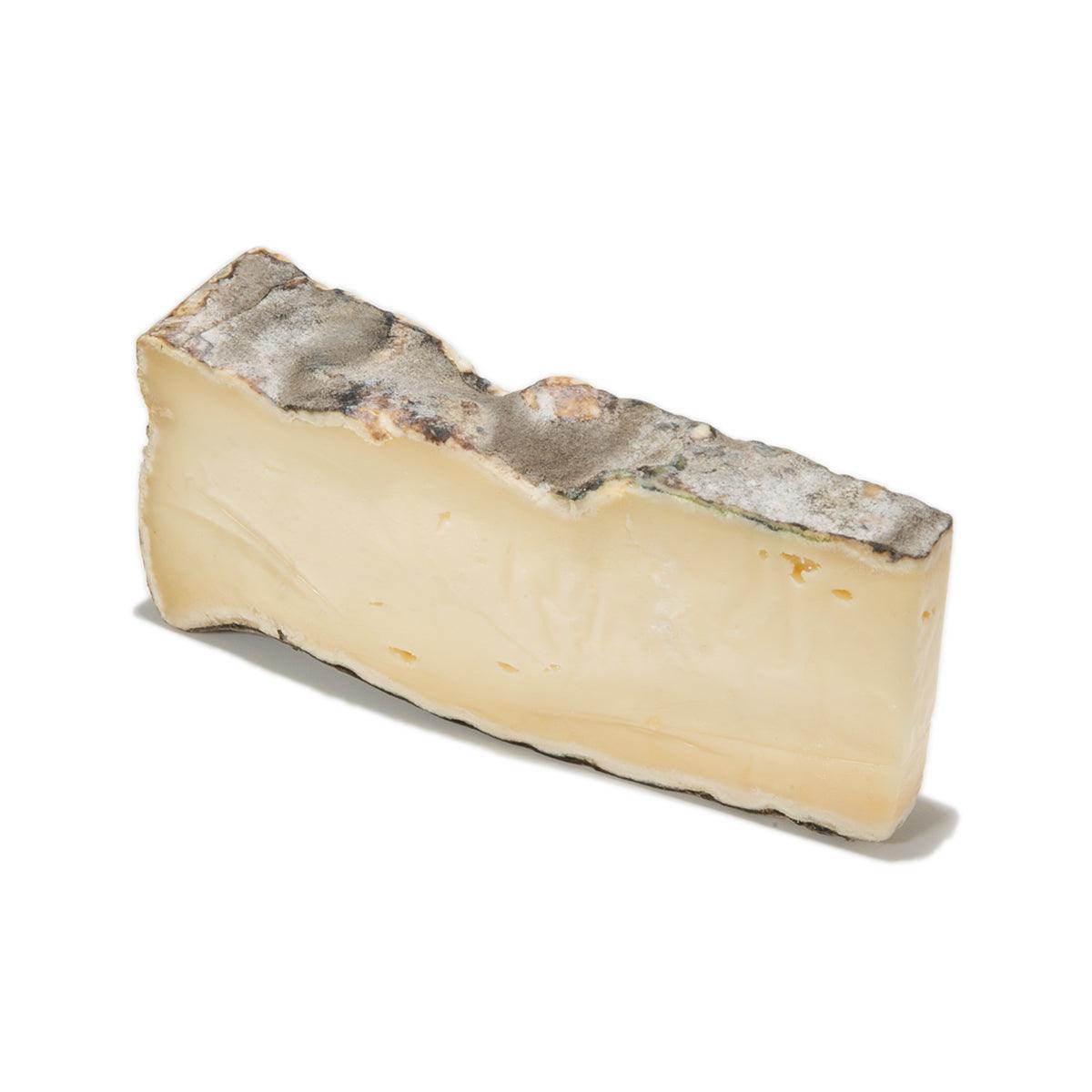 LES FRERES MARCHAND Saint Nectaire raw milk cheese wedge, pale interior, gray rind