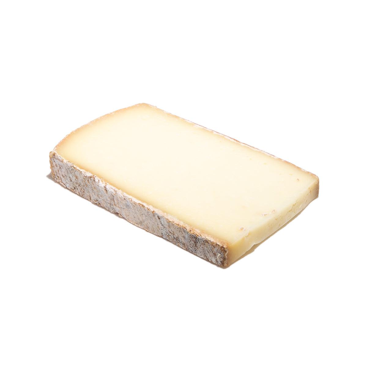 LES FRERES MARCHAND raclette cheese wedge, pale yellow interior, rind on one side