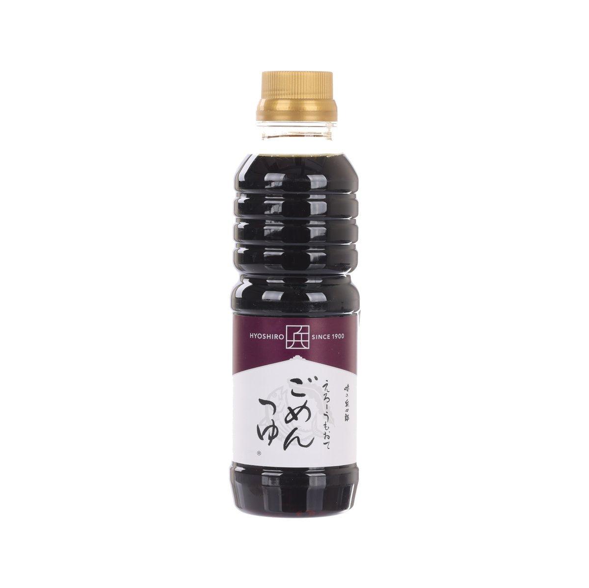Dark soy-based soup base in plastic bottle with gold cap, front label visible